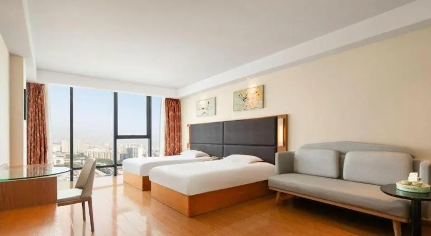 Bed in Warmly Hotel Suzhou Shuanghuwan