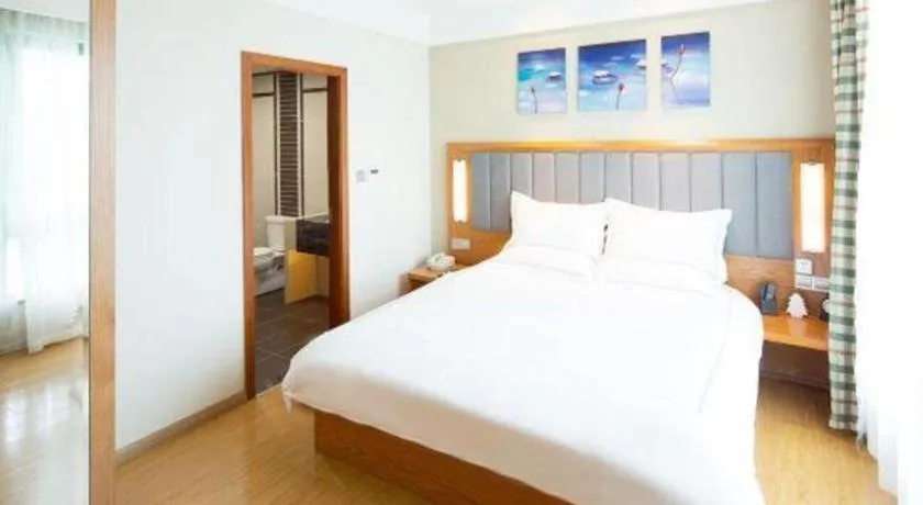 Bed in Warmly Hotel Suzhou Shuanghuwan