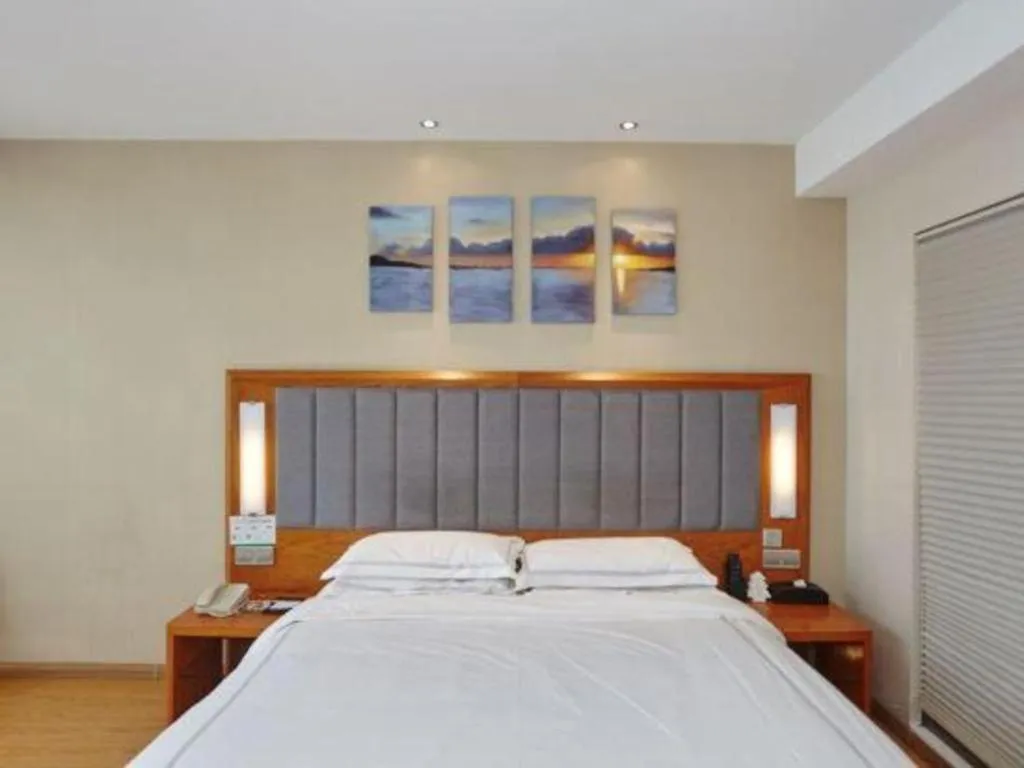 Bed in Warmly Hotel Suzhou Shuanghuwan