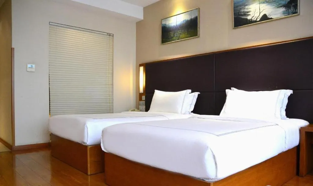 Bed in Warmly Hotel Suzhou Shuanghuwan