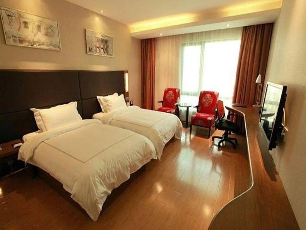 Bed in Warmly Hotel Suzhou Shuanghuwan