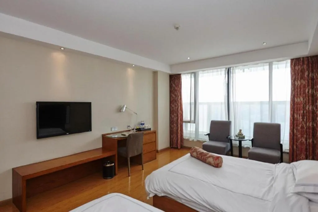 Bed in Warmly Hotel Suzhou Shuanghuwan