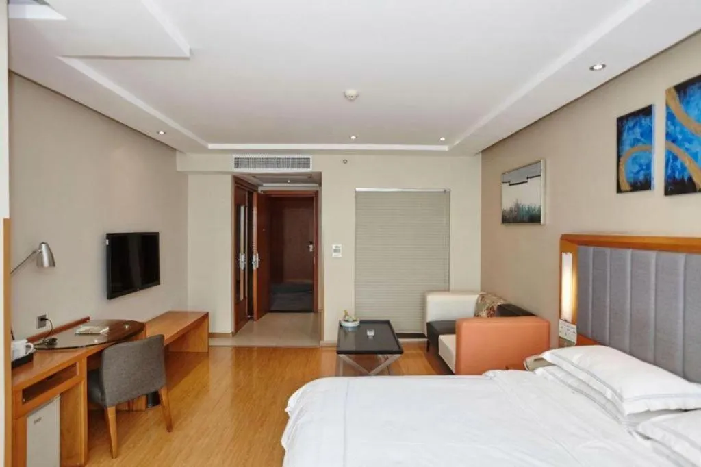 Bed in Warmly Hotel Suzhou Shuanghuwan