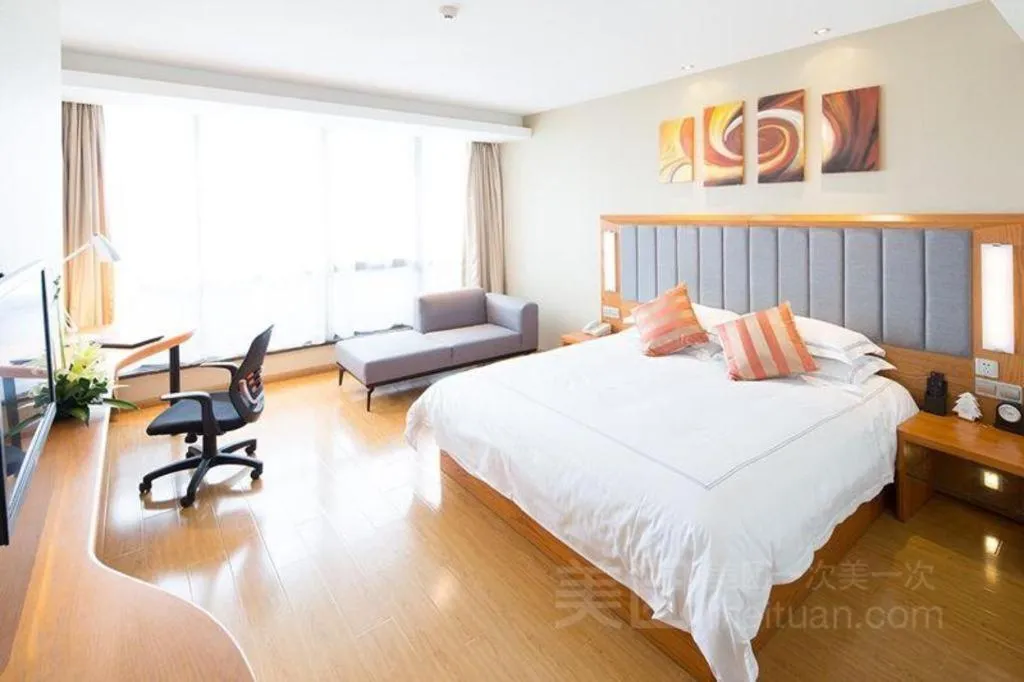 Bed in Warmly Hotel Suzhou Shuanghuwan