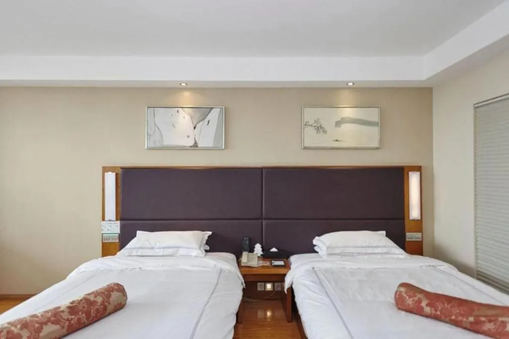 Bed in Warmly Hotel Suzhou Shuanghuwan