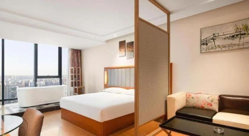 Bed in Warmly Hotel Suzhou Shuanghuwan