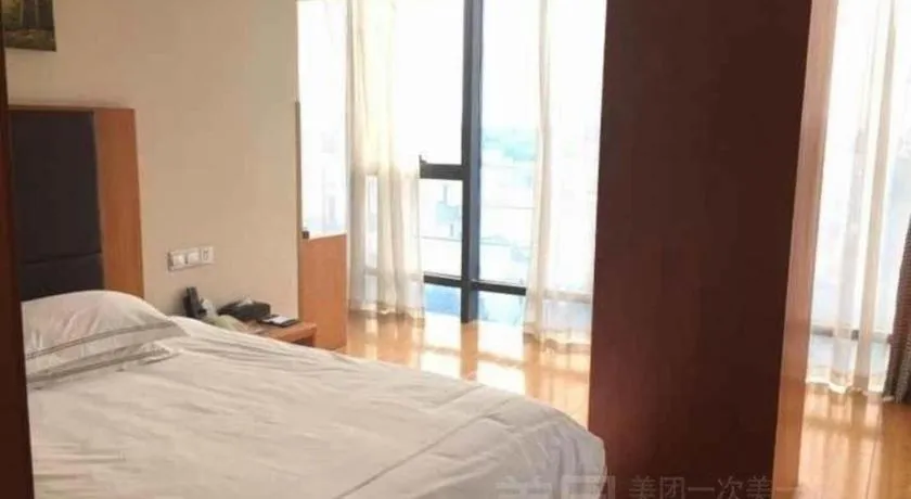 Bed in Warmly Hotel Suzhou Shuanghuwan