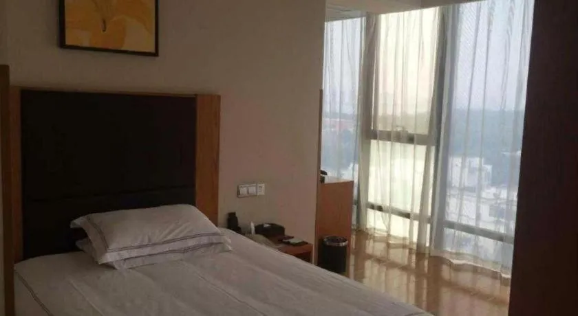 Bed in Warmly Hotel Suzhou Shuanghuwan