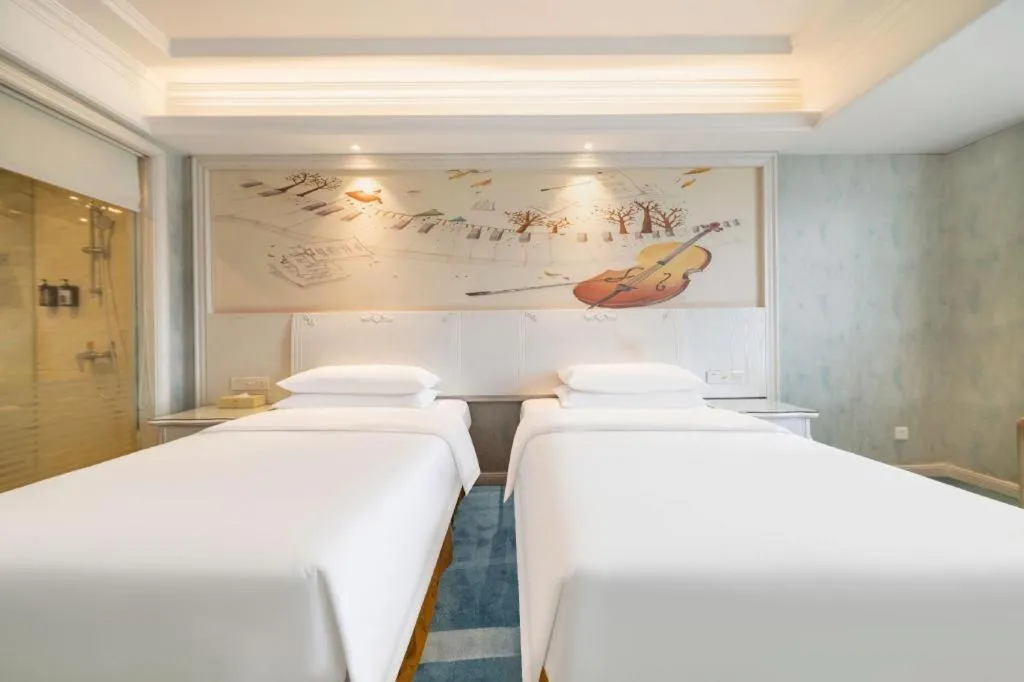 Bed in Vienna Hotel Guiyang Jiaxiulou Jichang Road