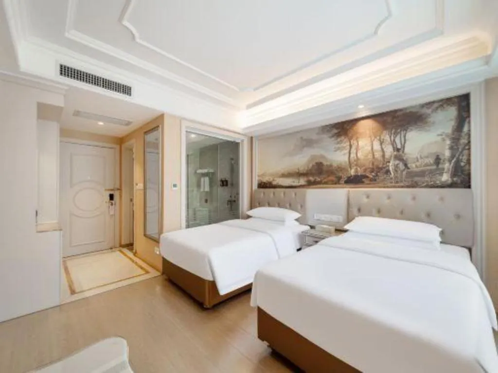 Bed in Vienna Hotel Guiyang Jiaxiulou Jichang Road