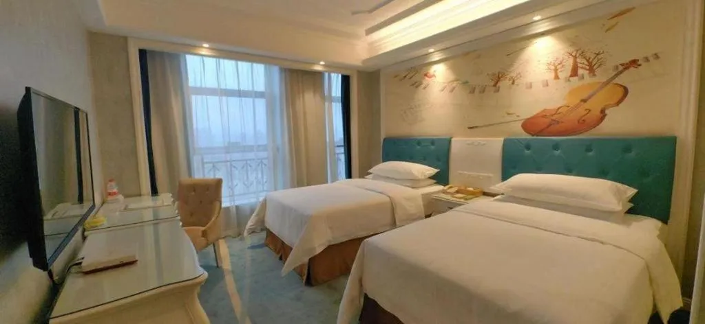 Bed in Vienna Hotel Guiyang Jiaxiulou Jichang Road