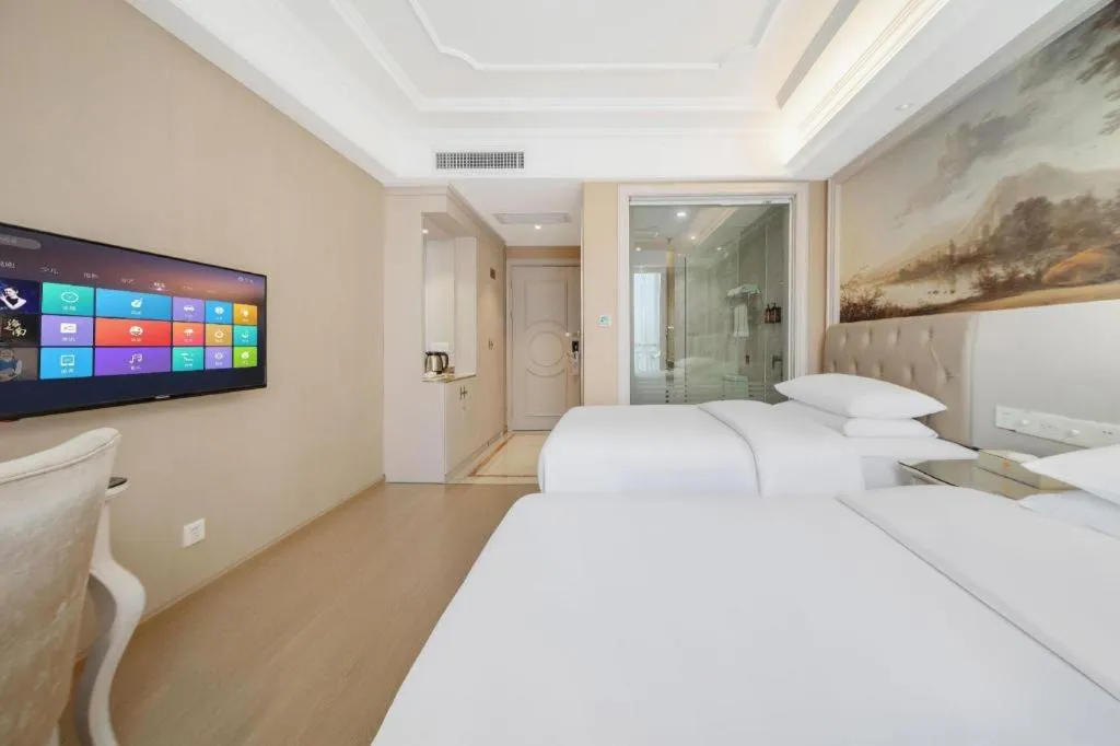 Bed in Vienna Hotel Guiyang Jiaxiulou Jichang Road