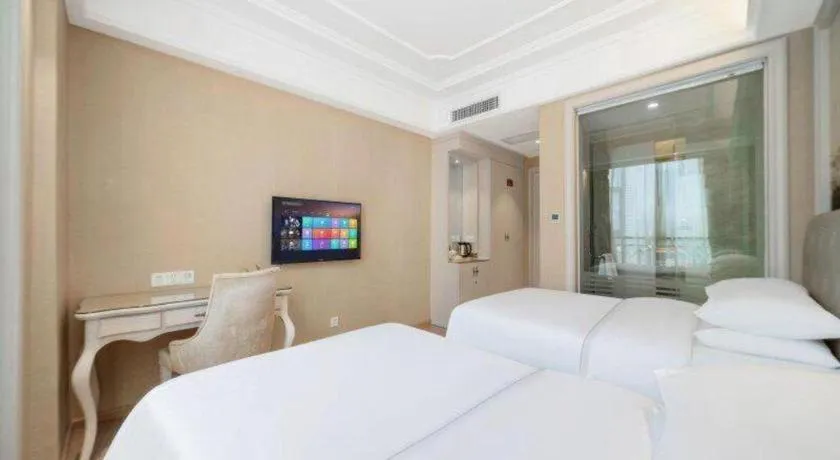 Bed in Vienna Hotel Guiyang Jiaxiulou Jichang Road