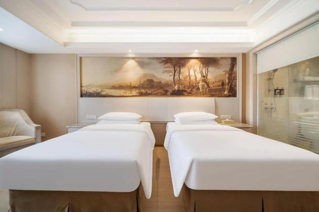 Bed in Vienna Hotel Guiyang Jiaxiulou Jichang Road