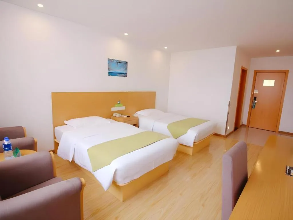 Bed in GreenTree Alliance Suzhou Zhangjiagang Nanfeng Town Hotel