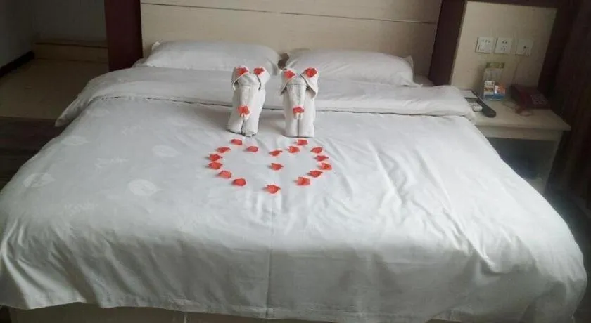 Bed in JUNYI Hotel Jiangxi Xinyu Baoshi Park