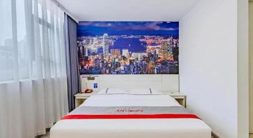 Bed in JUNYI Hotel Jiangxi Xinyu Baoshi Park