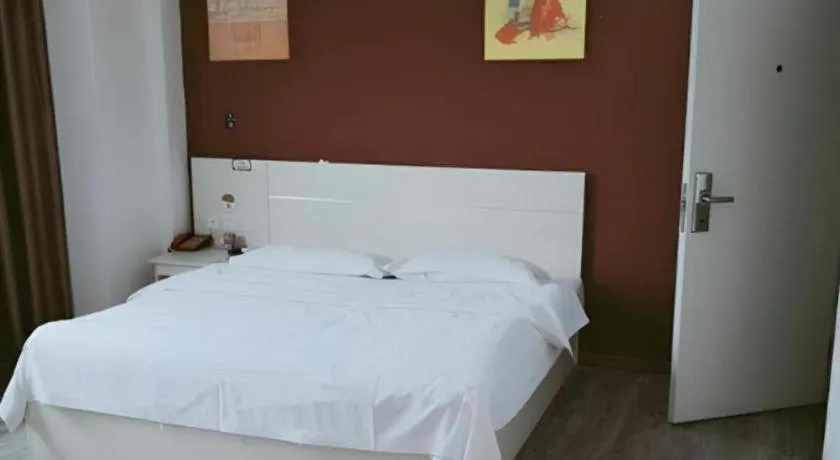 Bed in JUNYI Hotel Jiangxi Xinyu Baoshi Park