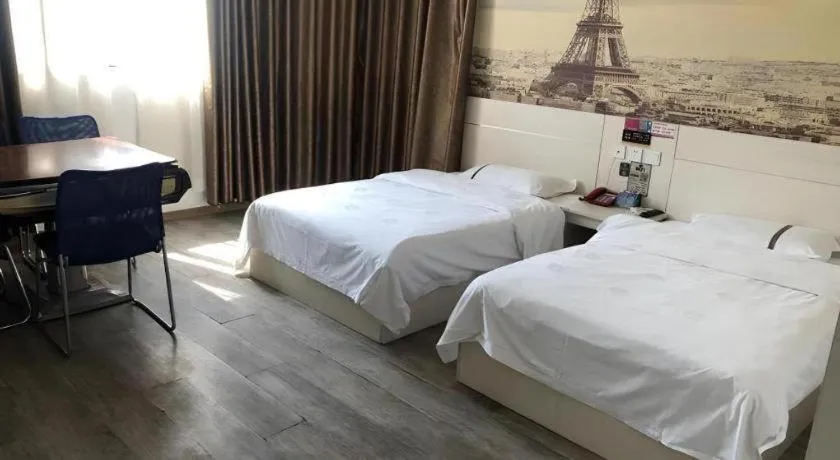 Bed in JUNYI Hotel Jiangxi Xinyu Baoshi Park