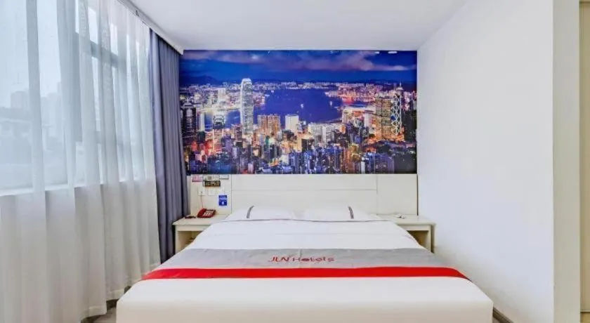 Bed in JUNYI Hotel Jiangxi Xinyu Baoshi Park