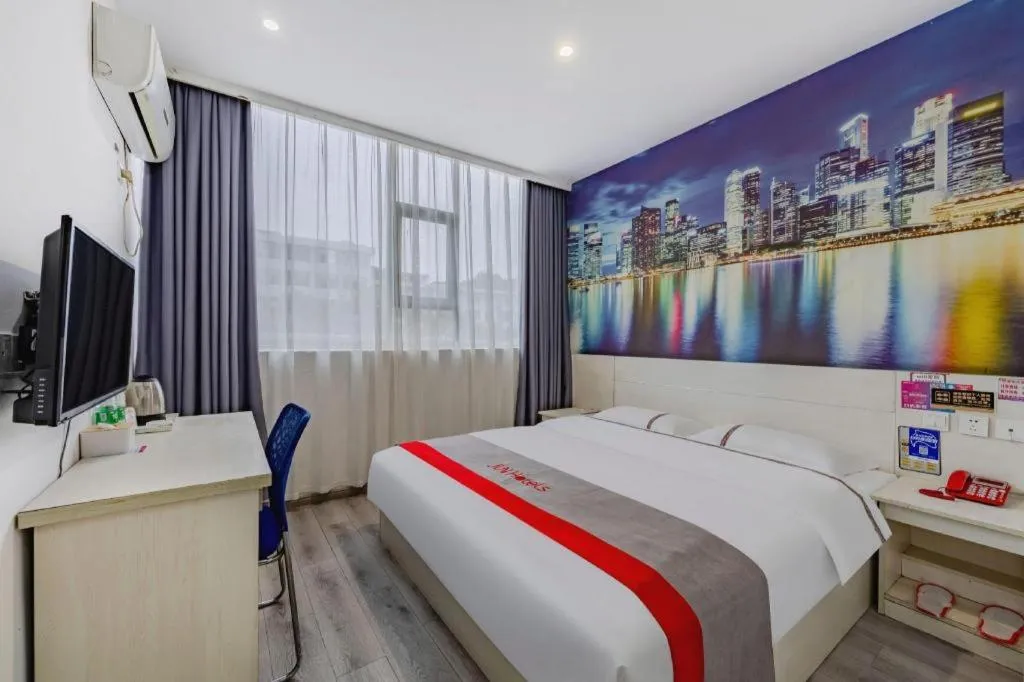 Bed in JUNYI Hotel Jiangxi Xinyu Baoshi Park