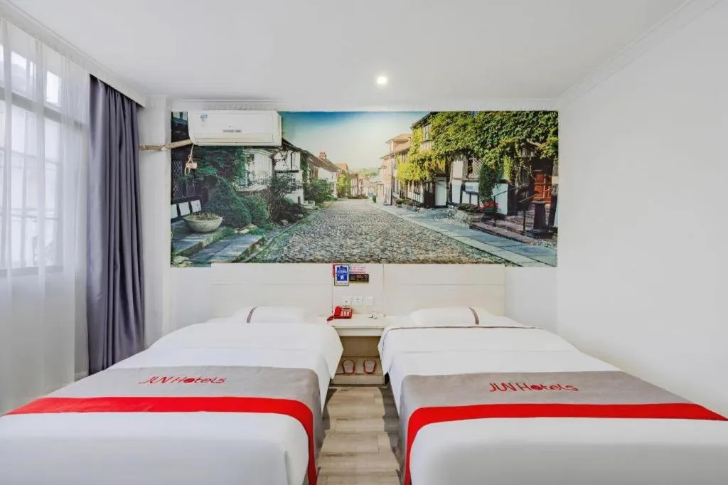 Bed in JUNYI Hotel Jiangxi Xinyu Baoshi Park