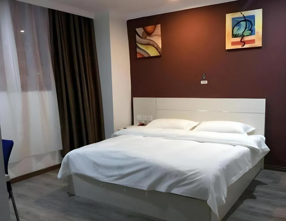 Bed in JUNYI Hotel Jiangxi Xinyu Baoshi Park