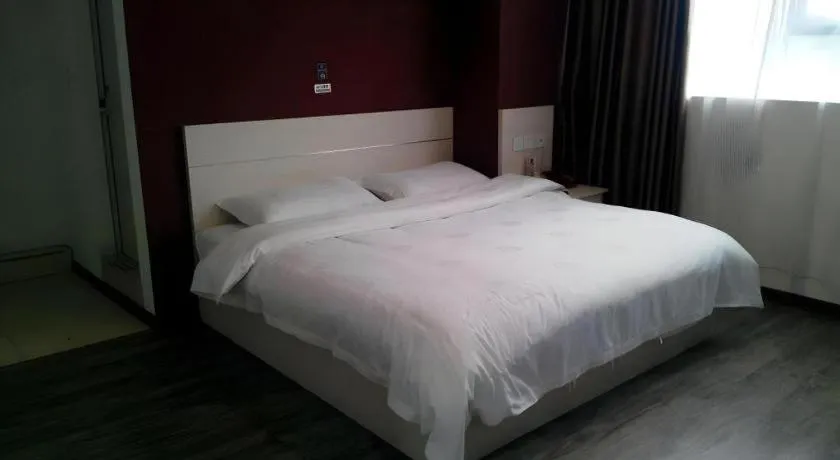 Bed in JUNYI Hotel Jiangxi Xinyu Baoshi Park