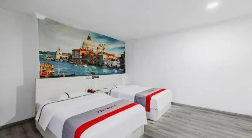 Bed in JUNYI Hotel Jiangxi Xinyu Baoshi Park