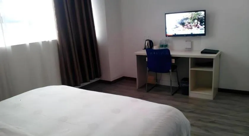 Bed in JUNYI Hotel Jiangxi Xinyu Baoshi Park