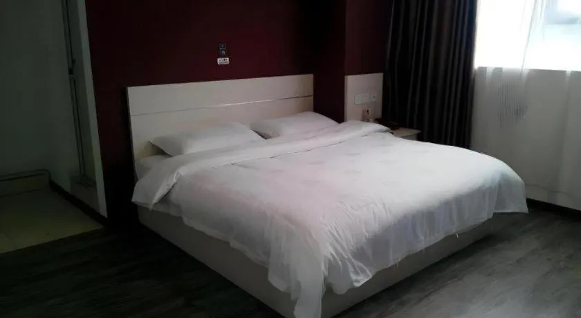 Bed in JUNYI Hotel Jiangxi Xinyu Baoshi Park