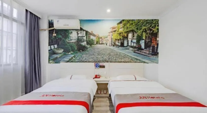 Bed in JUNYI Hotel Jiangxi Xinyu Baoshi Park
