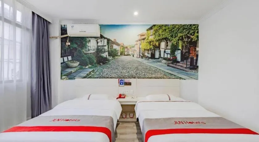 Bed in JUNYI Hotel Jiangxi Xinyu Baoshi Park