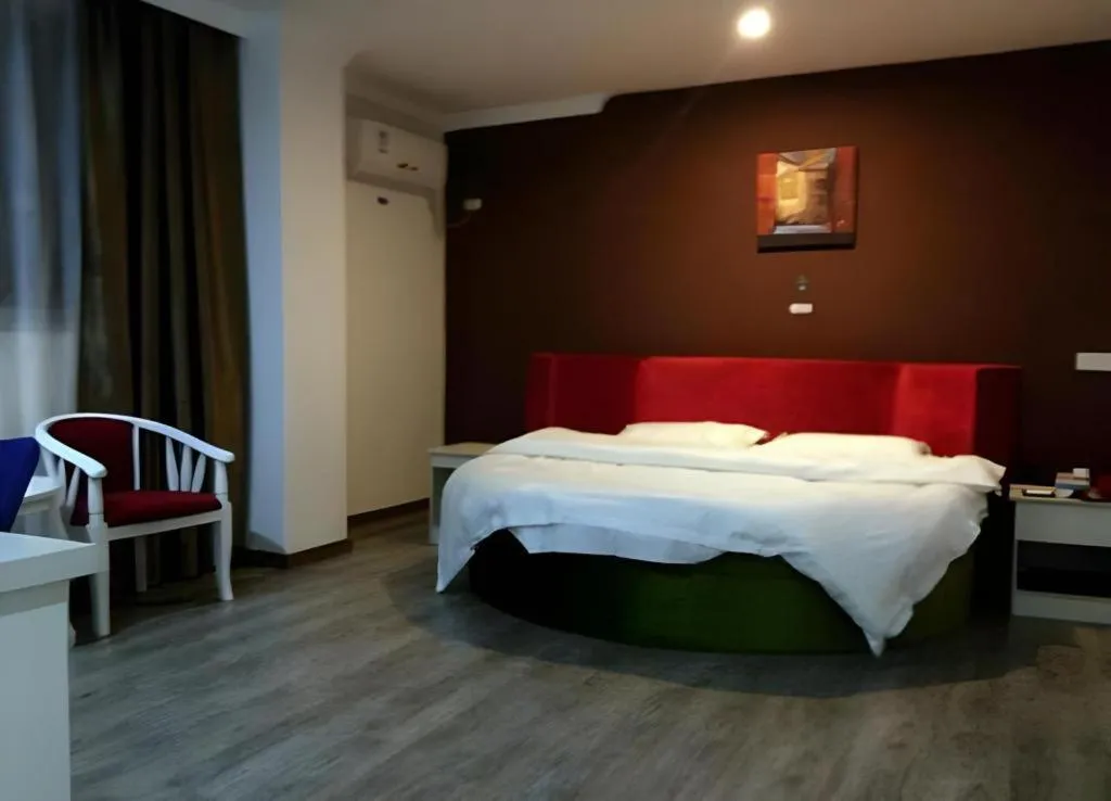 Bed in JUNYI Hotel Jiangxi Xinyu Baoshi Park