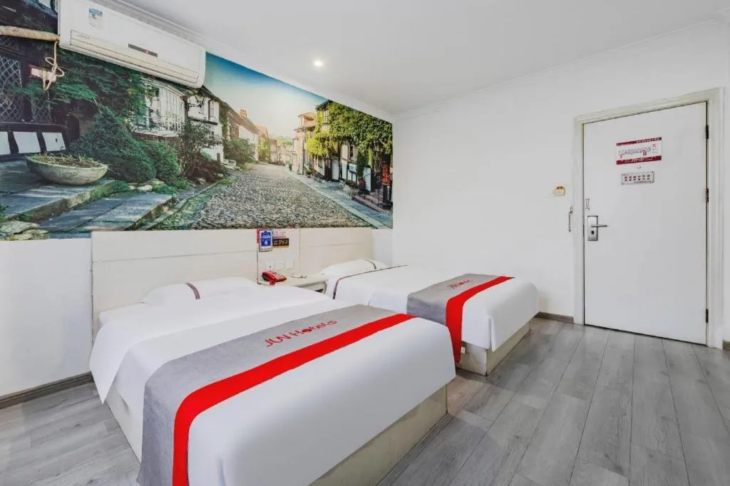 Bed in JUNYI Hotel Jiangxi Xinyu Baoshi Park