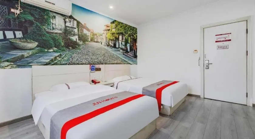 Bed in JUNYI Hotel Jiangxi Xinyu Baoshi Park