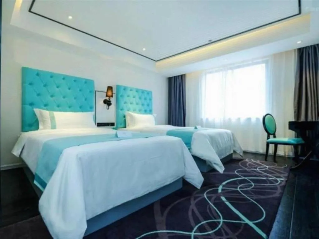 Bed in Xana Hotelle Chongqing Jiefangbei Center Branch