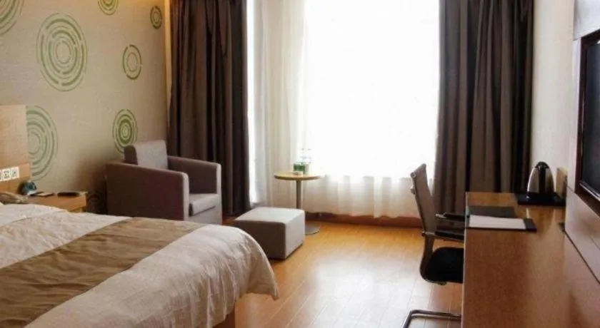 Bed in GreenTree Inn Shandong Heze Caoxian Zhuangzhai Town Oriental Times City Business Hotel