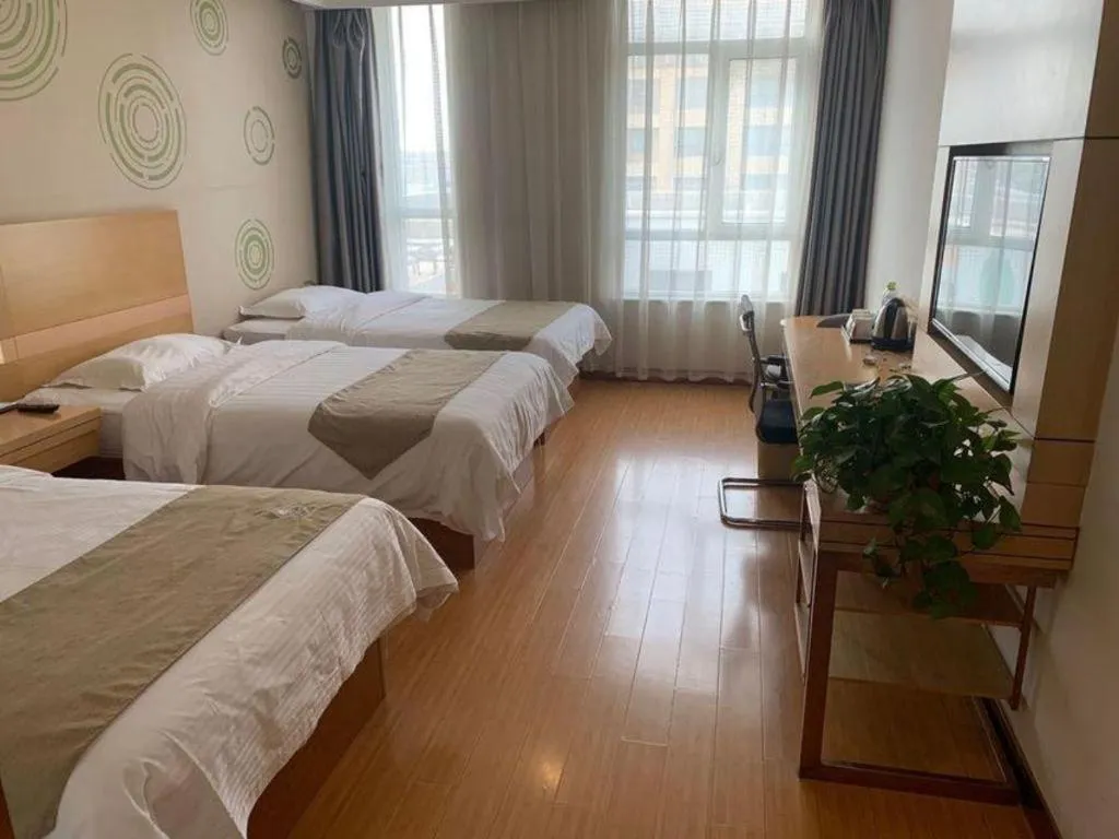 Bed in GreenTree Inn Shandong Heze Caoxian Zhuangzhai Town Oriental Times City Business Hotel