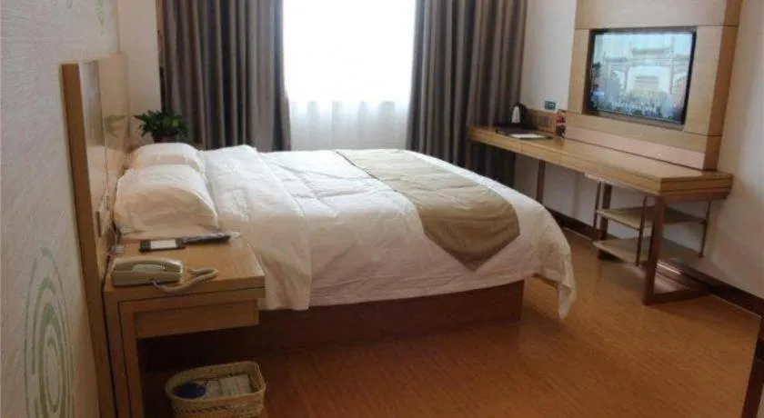 Bed in GreenTree Inn Shandong Heze Caoxian Zhuangzhai Town Oriental Times City Business Hotel