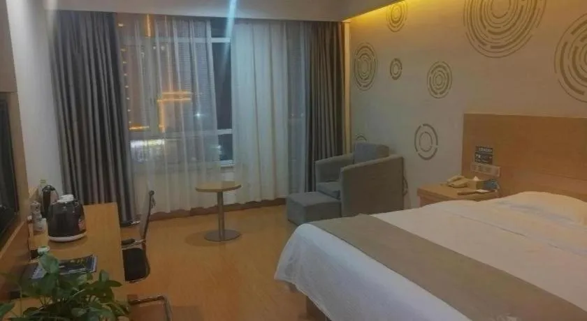 Bed in GreenTree Inn Shandong Heze Caoxian Zhuangzhai Town Oriental Times City Business Hotel