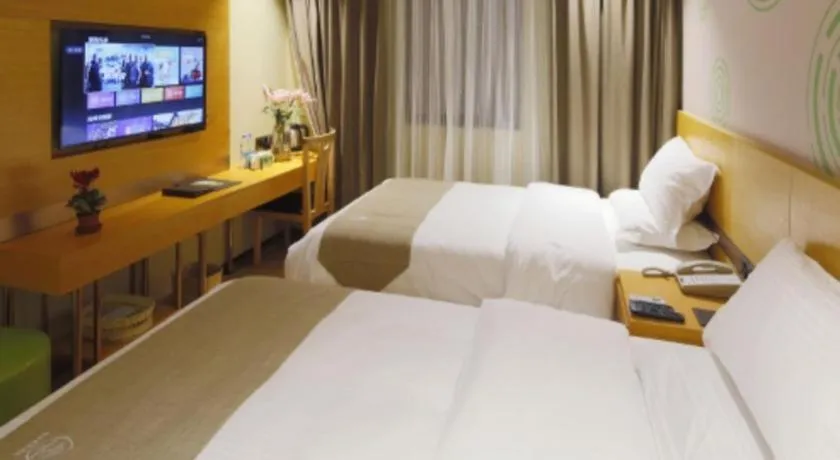 Bed in GreenTree Inn Shandong Heze Caoxian Zhuangzhai Town Oriental Times City Business Hotel