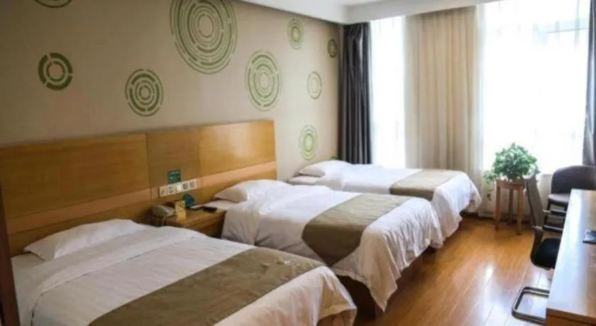 Bed in GreenTree Inn Shandong Heze Caoxian Zhuangzhai Town Oriental Times City Business Hotel