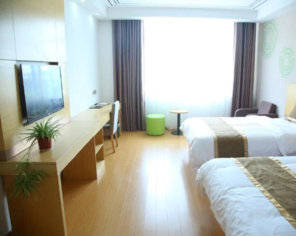 Bed in GreenTree Inn Shandong Heze Caoxian Zhuangzhai Town Oriental Times City Business Hotel