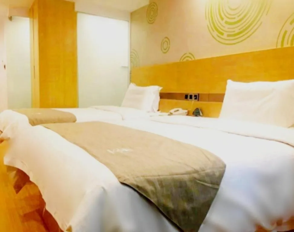 Bed in GreenTree Inn Shandong Heze Caoxian Zhuangzhai Town Oriental Times City Business Hotel