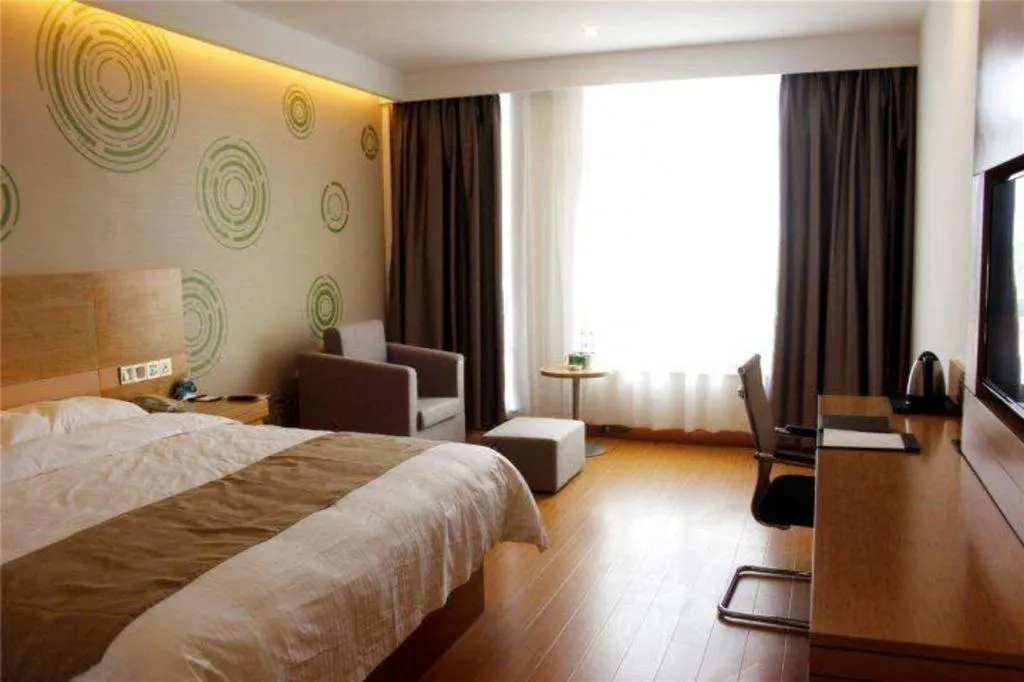 Bed in GreenTree Inn Shandong Heze Caoxian Zhuangzhai Town Oriental Times City Business Hotel