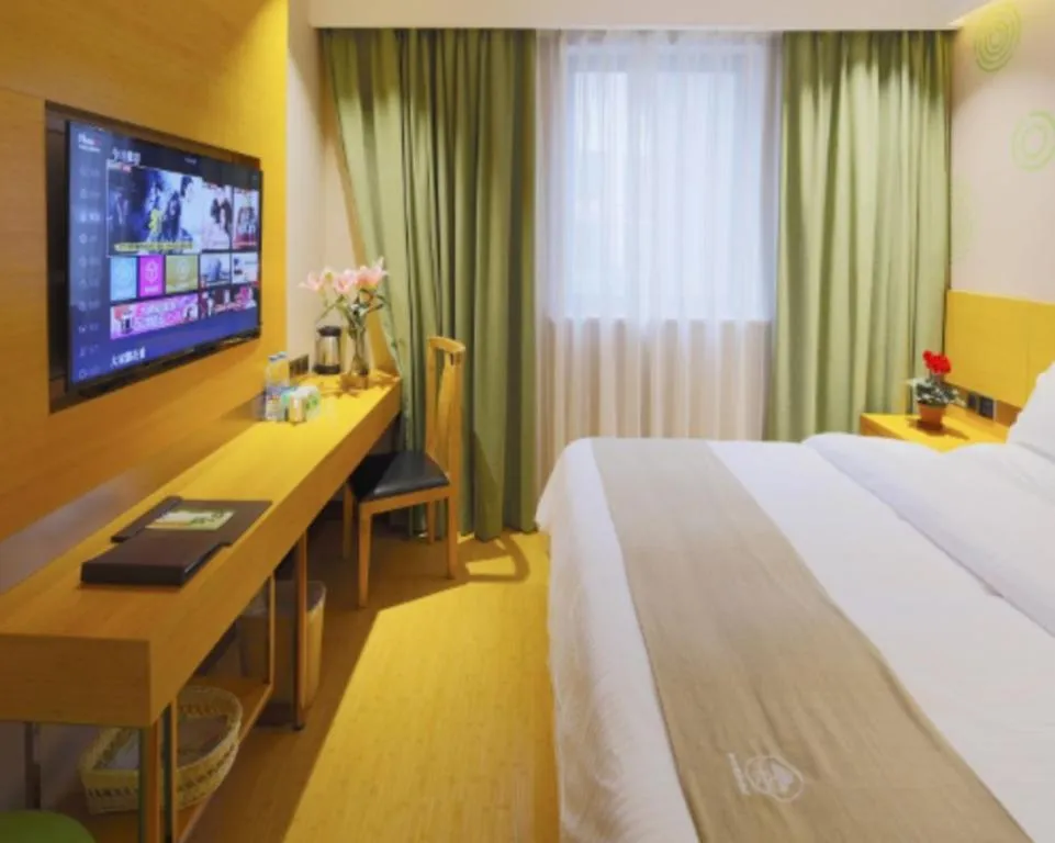 Bed in GreenTree Inn Shandong Heze Caoxian Zhuangzhai Town Oriental Times City Business Hotel