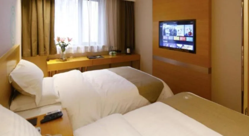 Bed in GreenTree Inn Shandong Heze Caoxian Zhuangzhai Town Oriental Times City Business Hotel