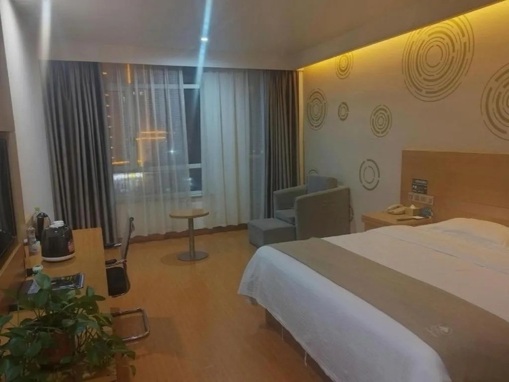 Bed in GreenTree Inn Shandong Heze Caoxian Zhuangzhai Town Oriental Times City Business Hotel