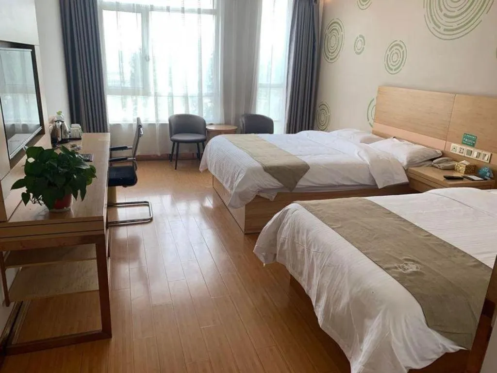 Bed in GreenTree Inn Shandong Heze Caoxian Zhuangzhai Town Oriental Times City Business Hotel